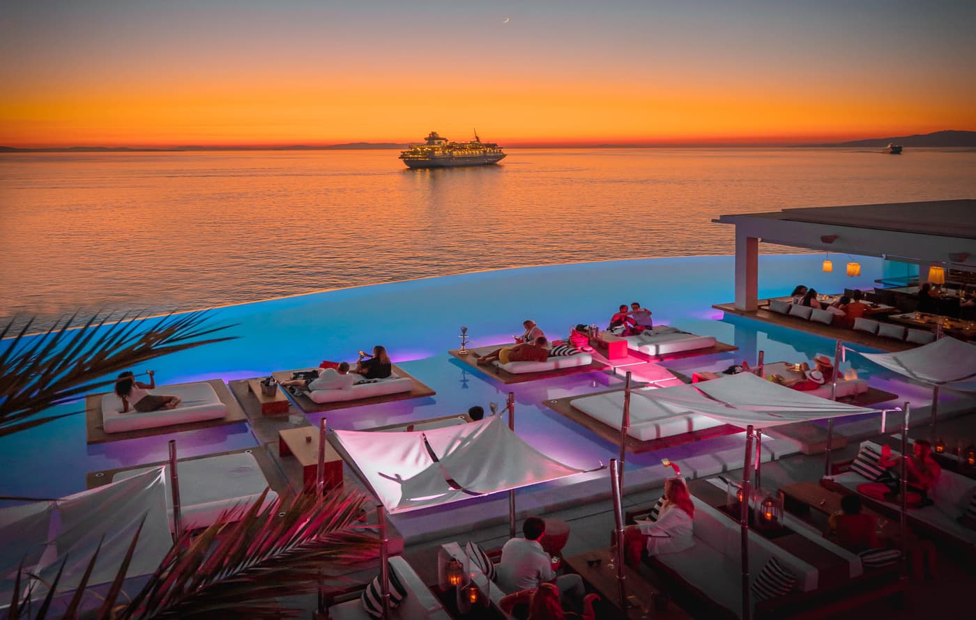 Cavo Tagoo pool terrace at sunset